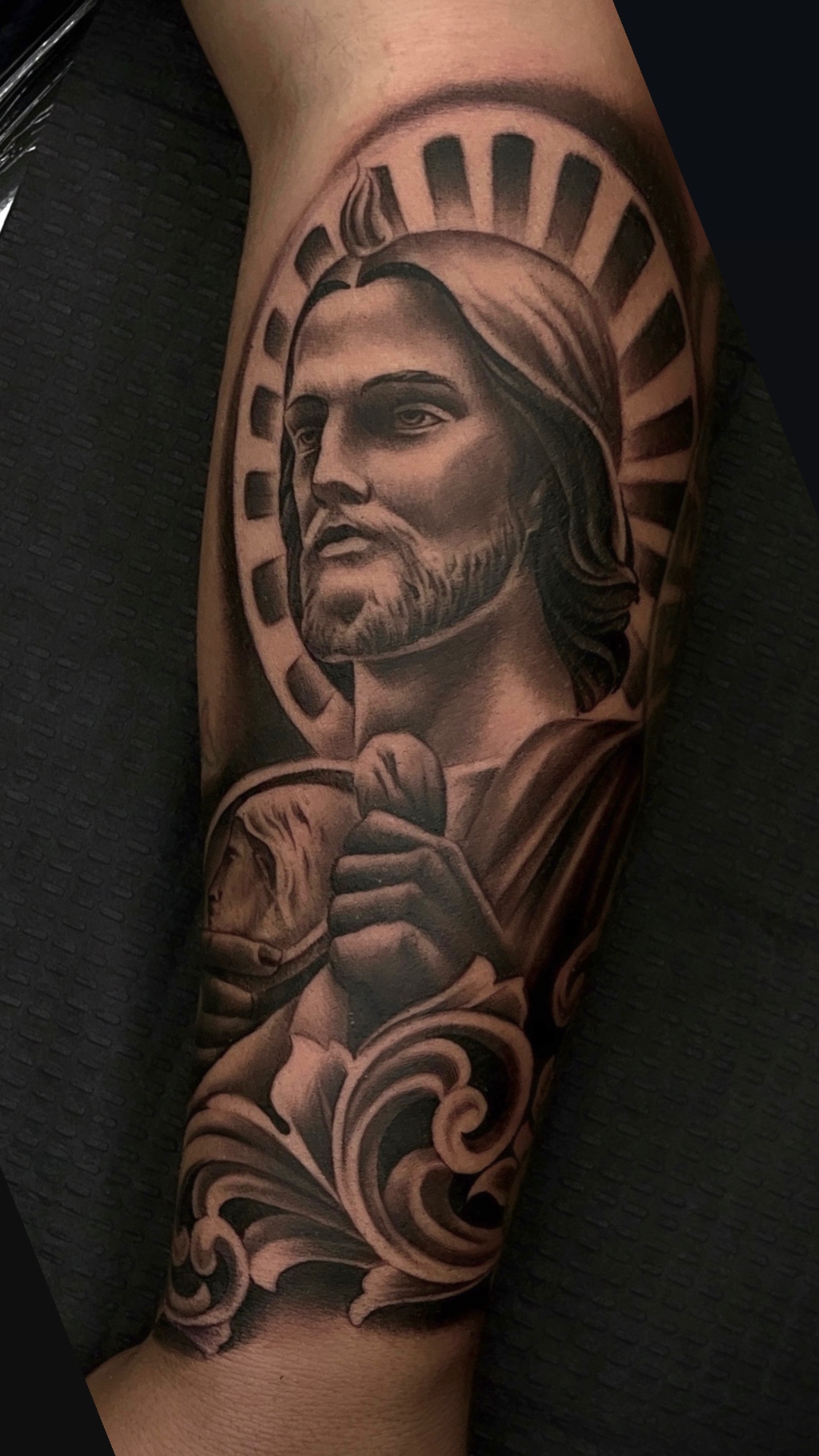 Black and gray realism sleeve tattoo by a Final Touch Tattoo artist in San Antonio